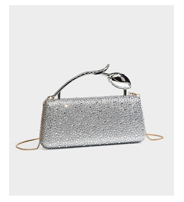 rectangular hard-case rhinestone evening clutch with sculptural gold-tone branch-and-bud top handle and detachable chain