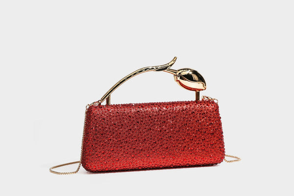 rectangular hard-case rhinestone evening clutch with sculptural gold-tone branch-and-bud top handle and detachable chain