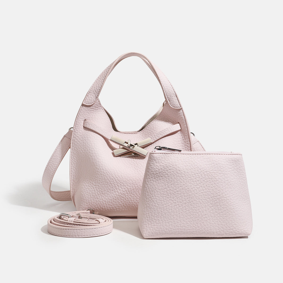 Compact pebbled leather-look shoulder bag with crossed silver-toned metal front closure, short top handle, and long, detail