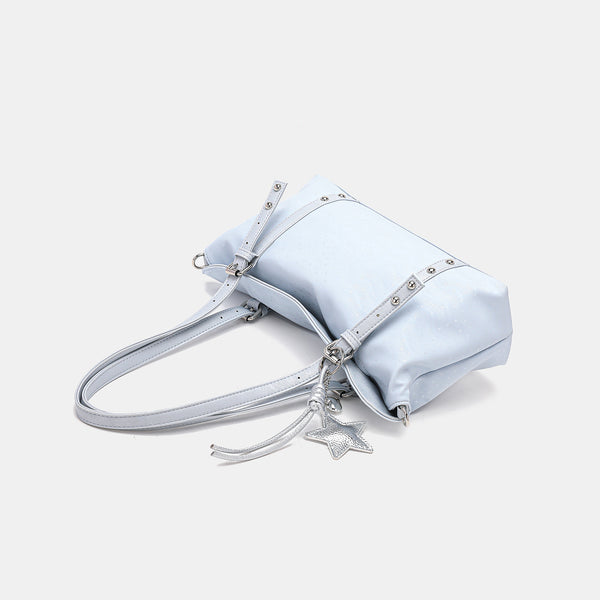 Slouchy leather-look shoulder tote bag with star charm pendant, silver-tone rivets and buckles, detail view 4