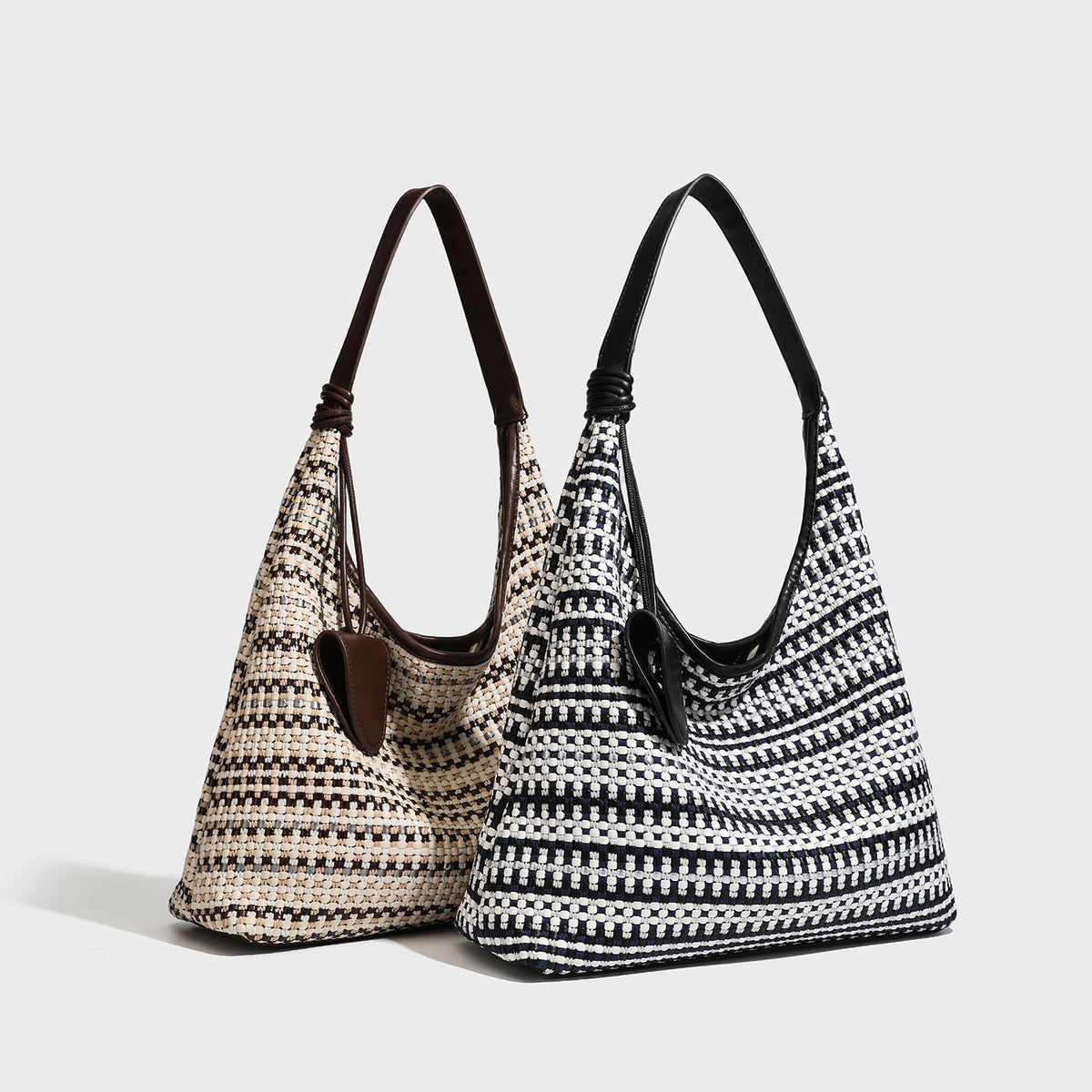 Slouchy woven stripe hobo shoulder bag with black-and-white pattern and leather-look strap, detail view 2