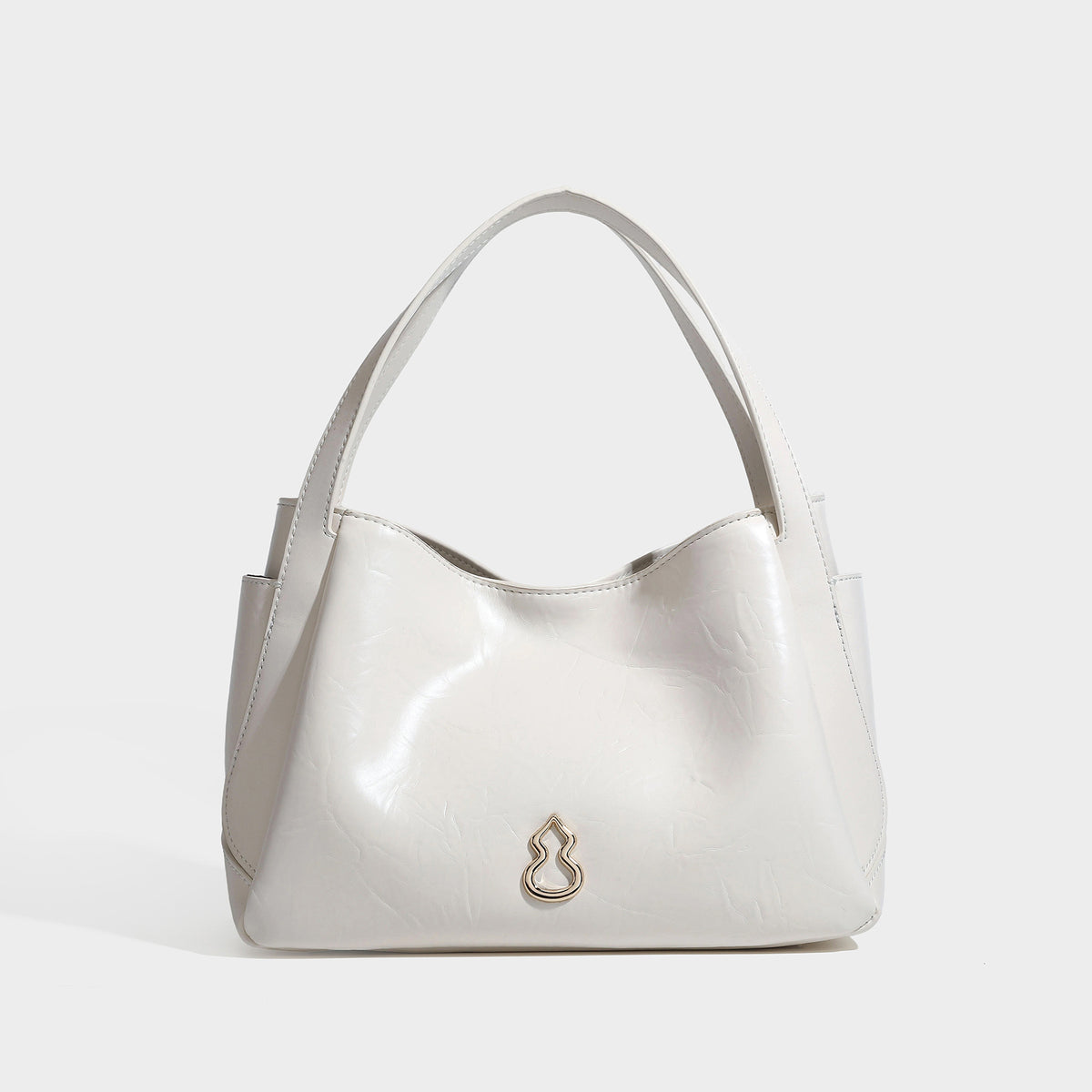 Black glossy crinkled leather-look convertible shoulder tote bag with gold gourd-shaped emblem hardware and detachable
