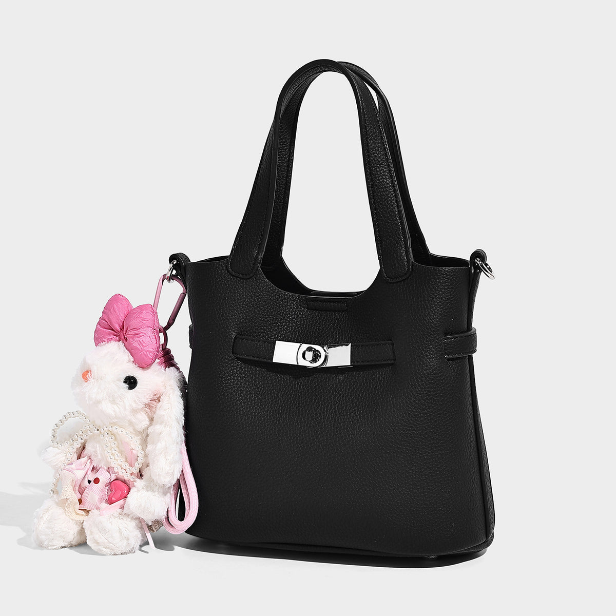 Kleine strukturierte Tote-Bag mit genarbter Oberfläche, silberfarbenem Drehverschluss und zwei Tragegriffen, Detailansicht 3