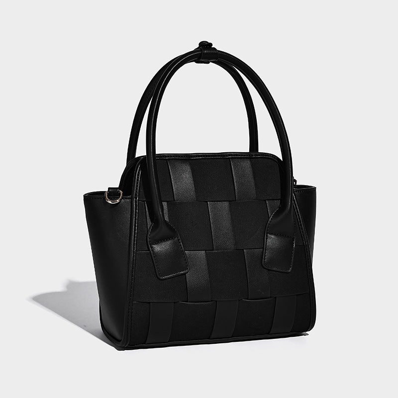 Small structured woven-panel mini tote bag with double top handles and detachable crossbody strap in matte leather-look